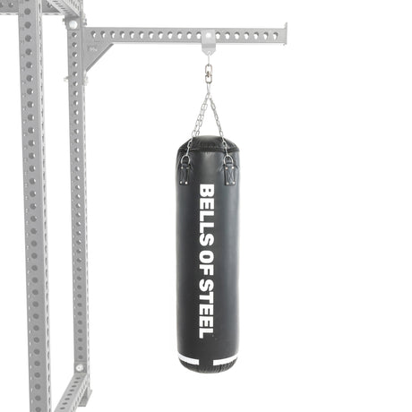 A black heavy bag from the Bells of Steel USA Heavy Bag Set hangs from a metal frame by chains against a white background, making it an ideal addition to any power rack or heavy bag set.
