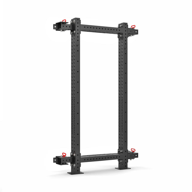 The Roc Foldable 4 Post Cage Builder by Bells of Steel features a freestanding black metal design with a rectangular frame, ⅝" bolt holes on the vertical beams, and red adjustment pins. Its minimalist design includes modular components against a plain white background.