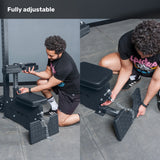 A person adjusts parts of a black Bells of Steel Lat Pulldown Low Row Machine in a gym. The text "Fully adjustable" is shown at the top.