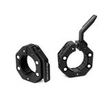 Two black, octagonal Magnetic Clamp Collars by Bells of Steel—one closed and upright, one open to reveal the lever mechanism. Both feature a modern, geometric design for secure lifts.