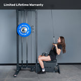 A woman sits on a bench using the Bells of Steel Lat Pulldown Low Row Machine with blue weight plates in a gym. "Limited Lifetime Warranty" appears at the top of the image.