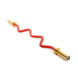 A red zigzag bicycle lock with gold-colored ends lies against a white background, echoing the sleek design of the Bells of Steel 100% RAW Competition Curl Bar.