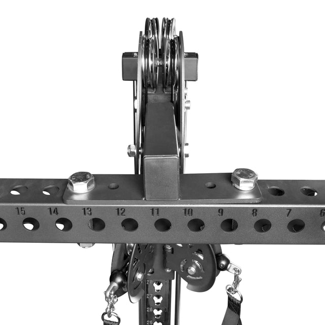 Close-up of the Bells of Steel 3x3 Cable Tower to Rack Connection Kit mounted on a horizontal beam, featuring numbered adjustment holes, bolts, and multiple cables and pulleys.