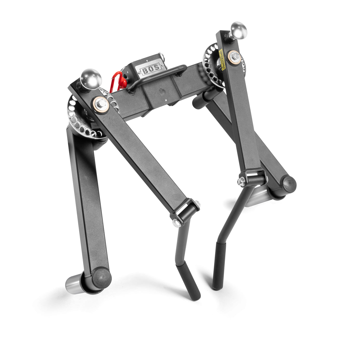 The Bells of Steel Shoulder Boulder/Chest Fly Attachment is a compact black metal device with adjustable arms, gears, and two bottom handles. Labeled "BOS," it’s a space-saving gym tool and dumbbell alternative for effective shoulder workouts.