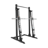 The Bells of Steel USA Smith Machine - Hydra (3" x 3", ⅝" Holes) features black steel construction, a pull-up bar, adjustable safety catches, and a fixed barbell—ideal for weightlifting and strength training.