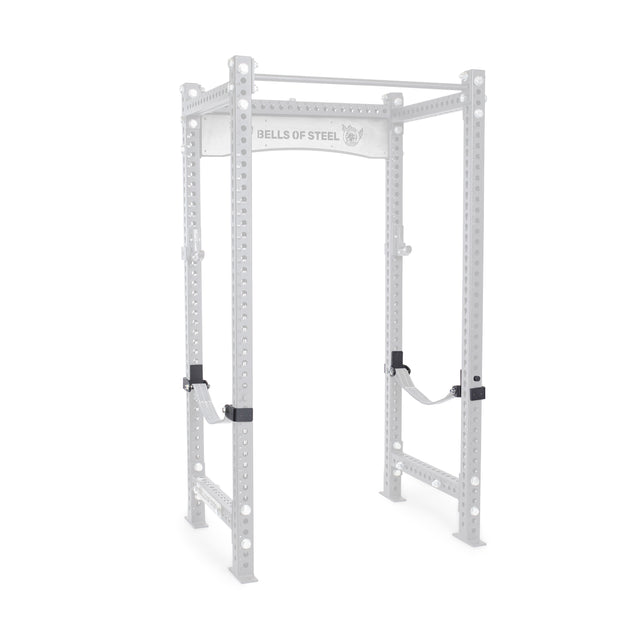 The Bells of Steel Safety Strap Connectors are displayed on a metal power rack with multiple adjustment holes and a top pull-up bar. The brand name is visible on a crossbeam, and the product is isolated against a white background.