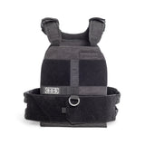 The Bells of Steel Weighted Vest is black with adjustable shoulder straps, various Velcro patches, a front "BOS" label, and a D-ring. It accommodates training plates for utility or protection.